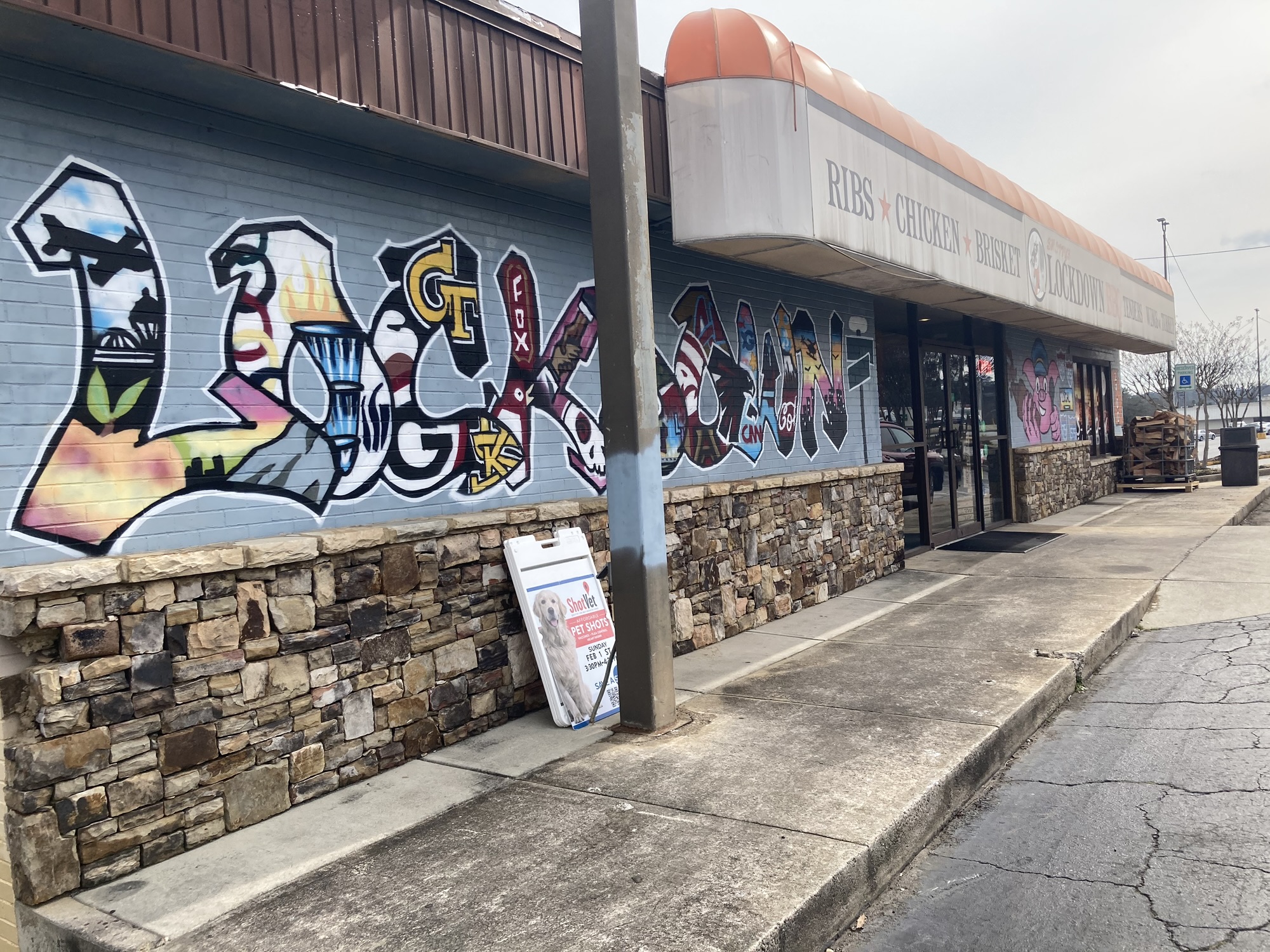 A restaurant is seen with the letters Lockdown painted extravagantly.